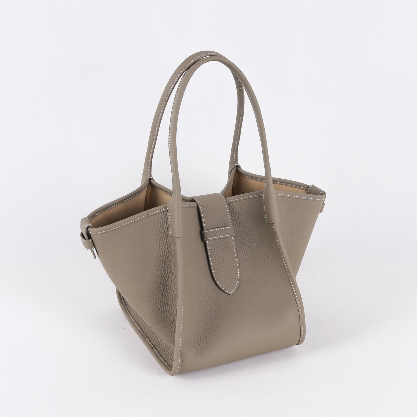 Beige handbag on a white background