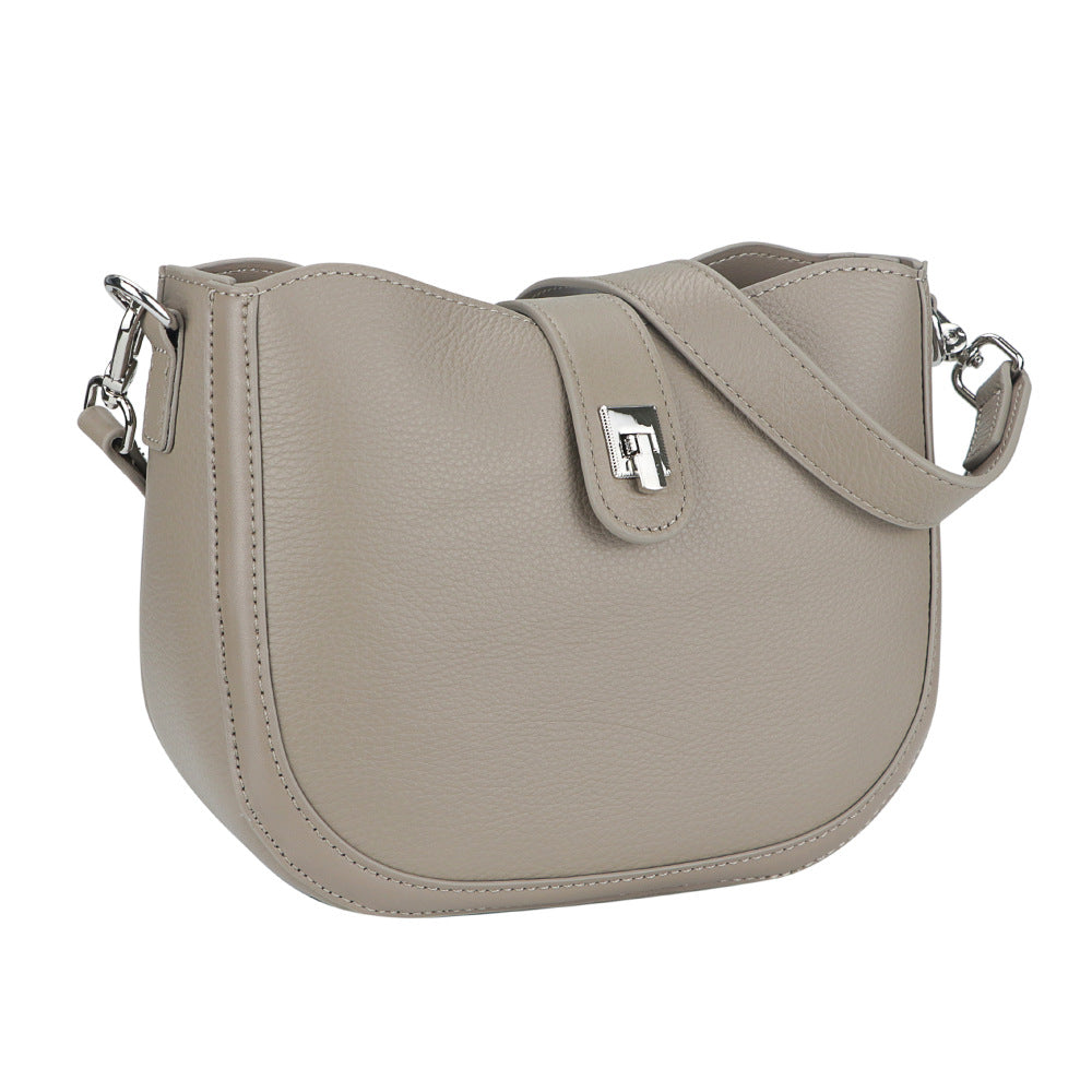 Beige handbag with a strap on a white background