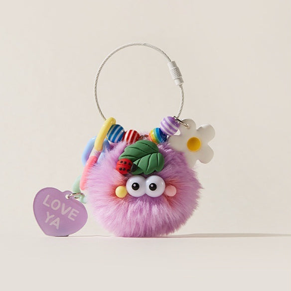 Colorful fluffy keychain with decorative elements