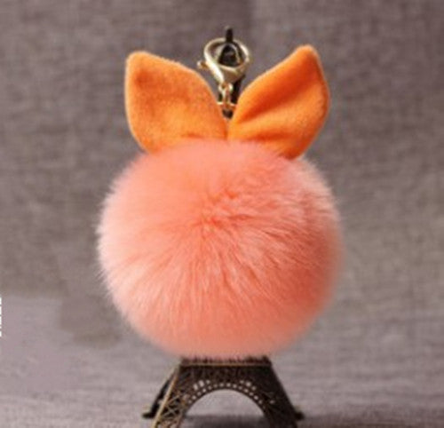 Fluffy pink keychain with orange
