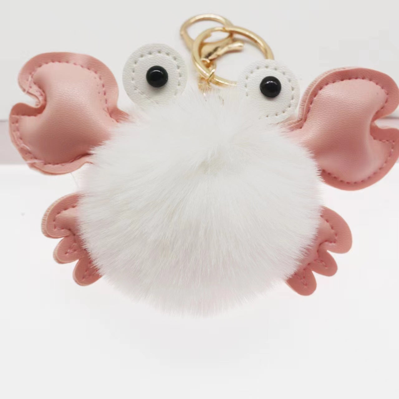 Fluffy white keychain with pink accents