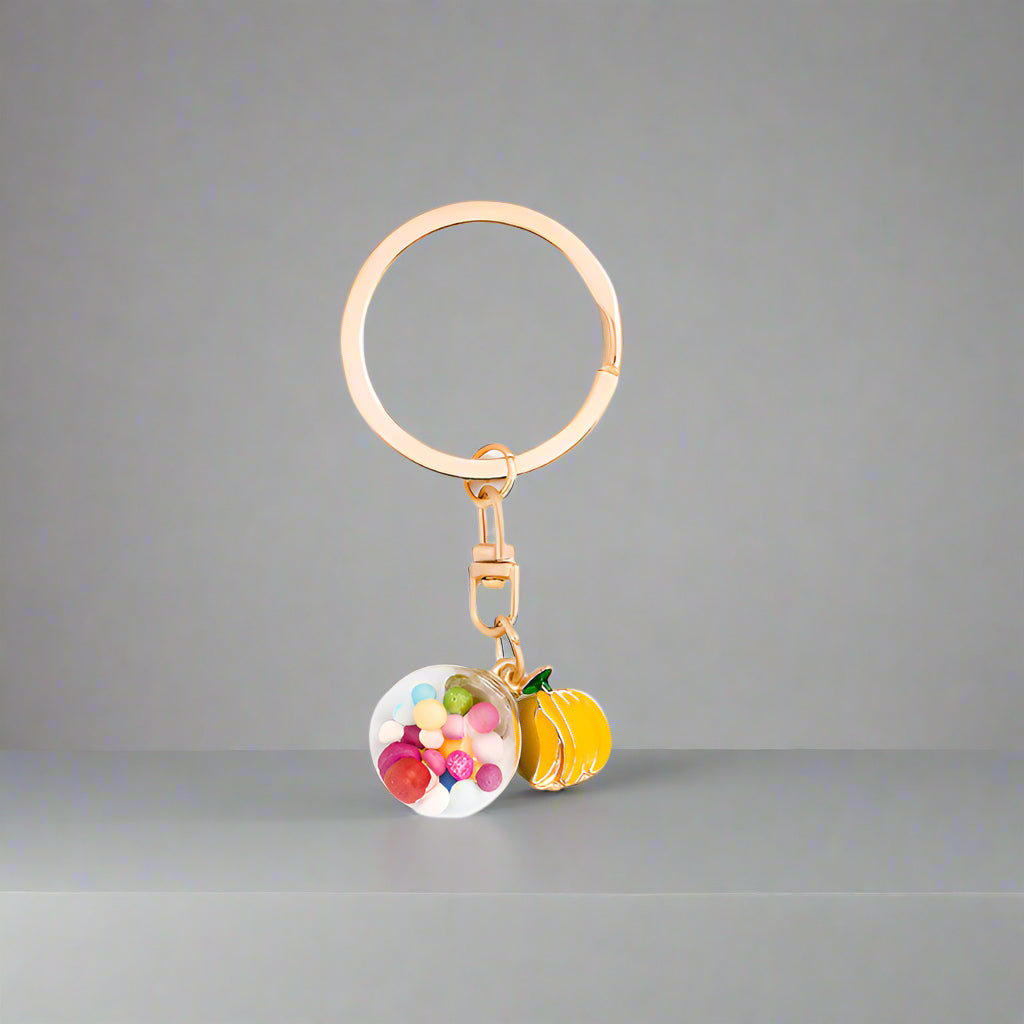 Keychain with colorful fruit charms on a light gray background