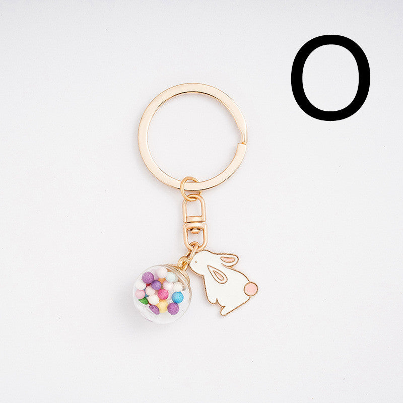 Keychain with rabbit and colorful ball design on a white background