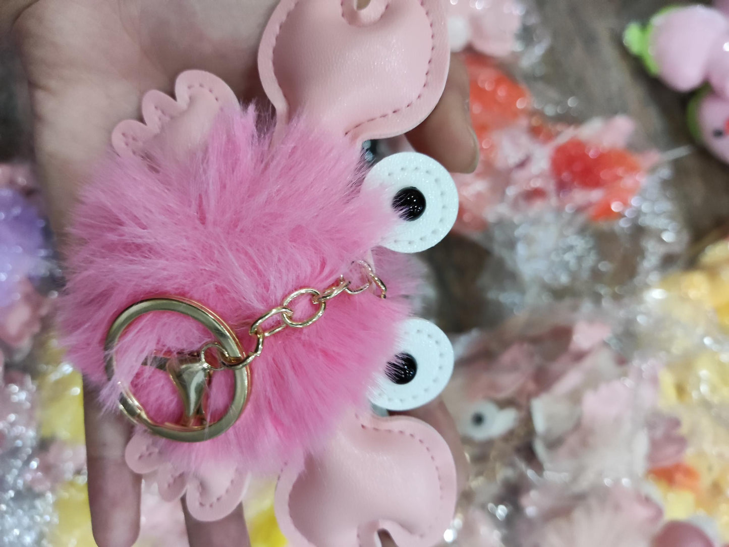 Pink fluffy keychain with a gold ring