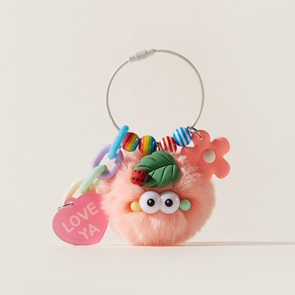 Pink plush toy with colorful beads and a 'LOVE YA' tag