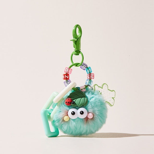 Plush toy keychain with a green clip