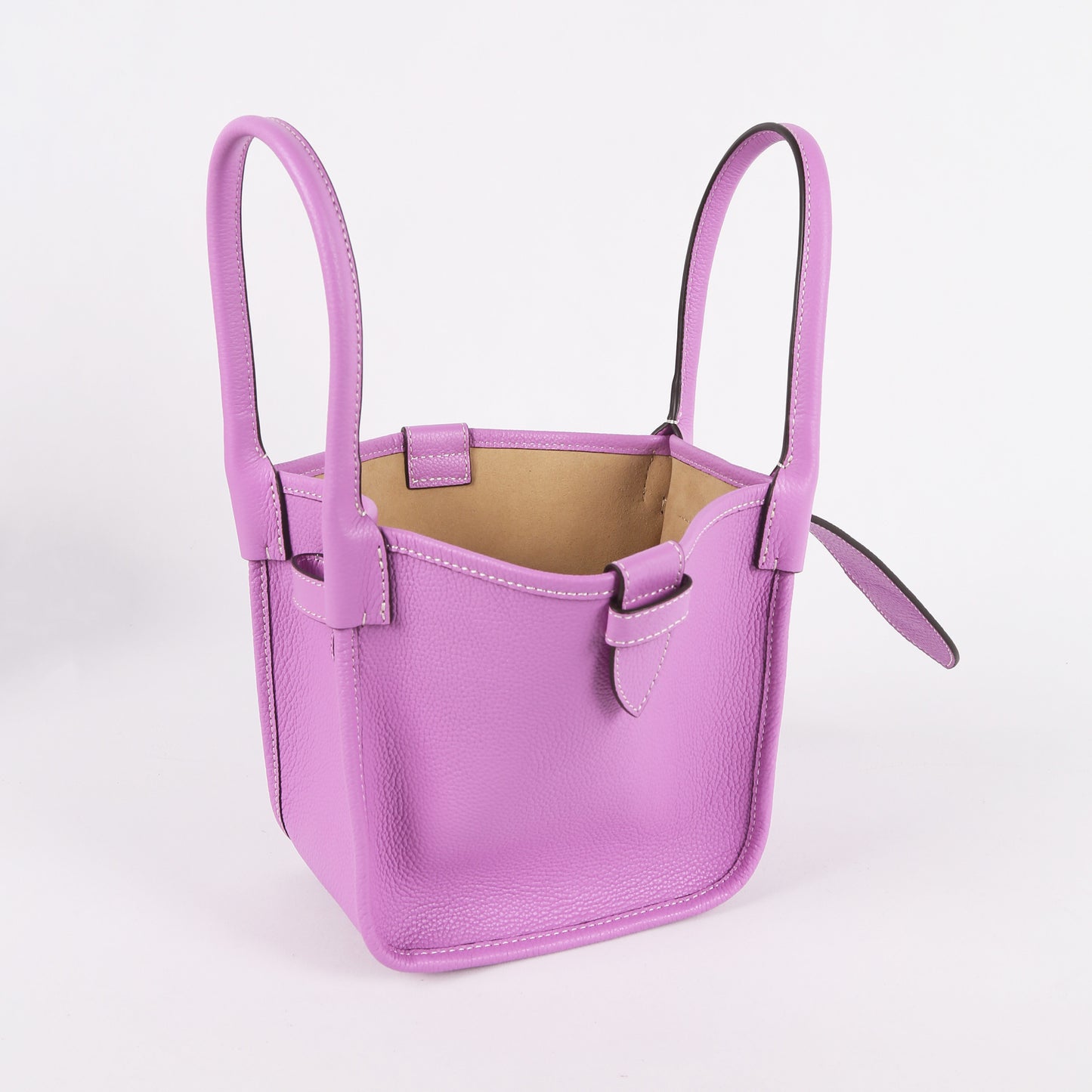 Purple handbag with handles on a light gray background