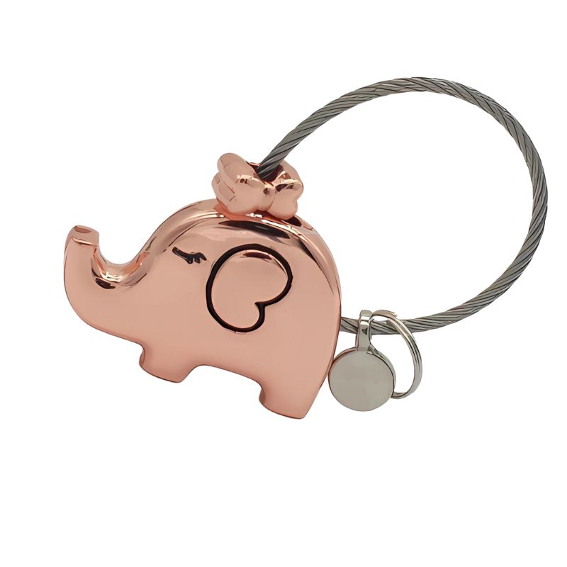 Rose gold elephant-shaped keychain with a silver tag on a white background