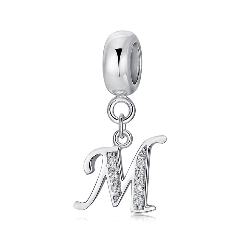 Silver charm with letter M