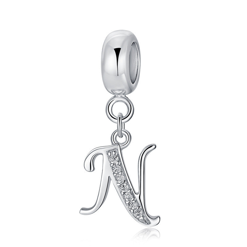 Silver charm with letter N