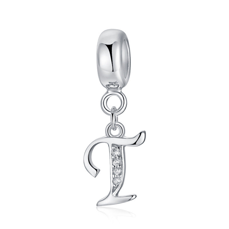 Silver charm with letter T