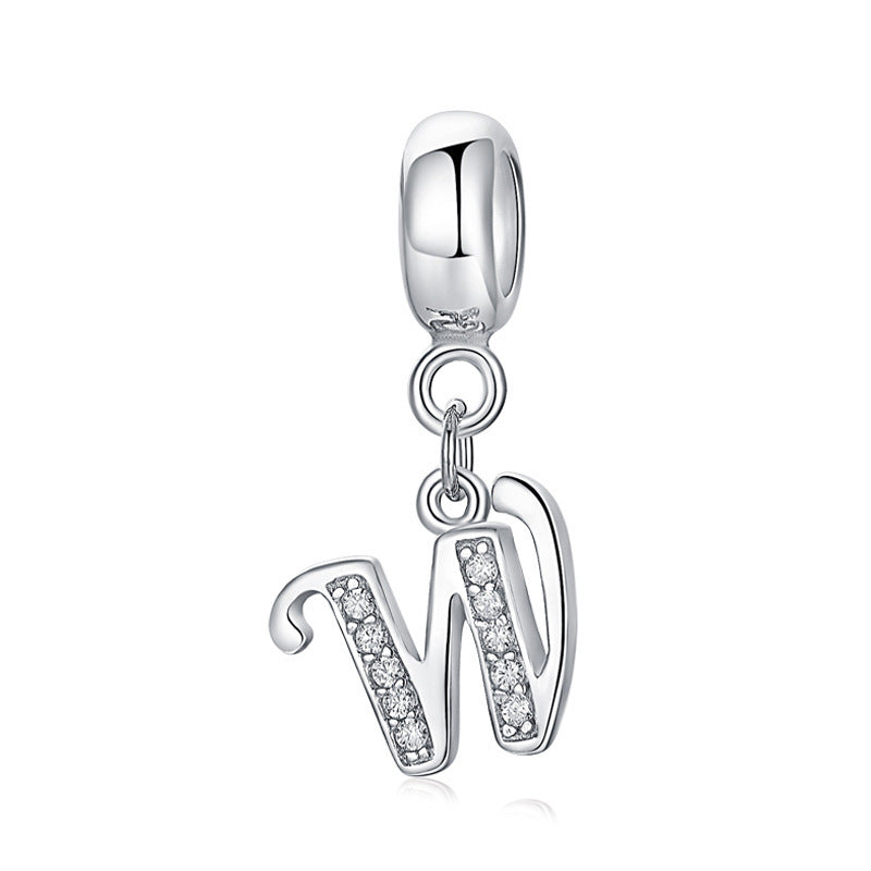 Silver charm with letter W