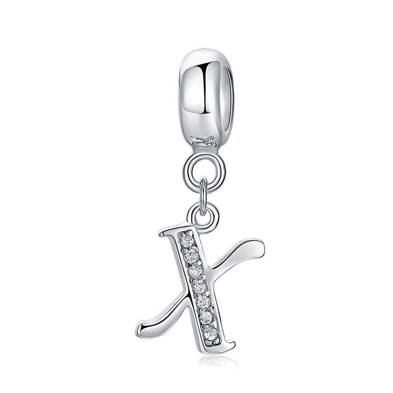 Silver charm with letter X
