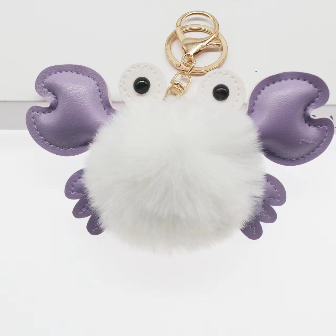 White fluffy keychain with purple