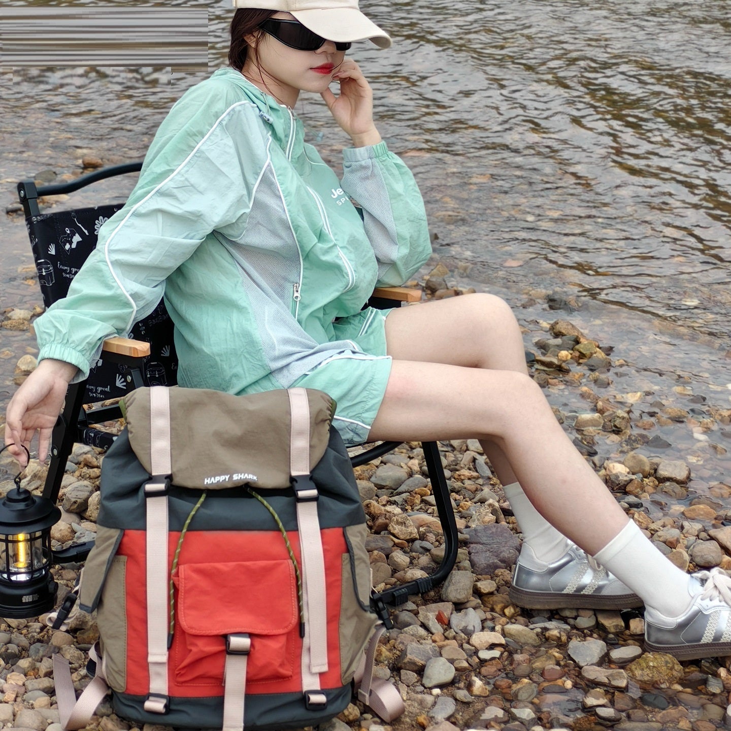 Opened outdoor backpack with multiple internal compartments and polyester lining