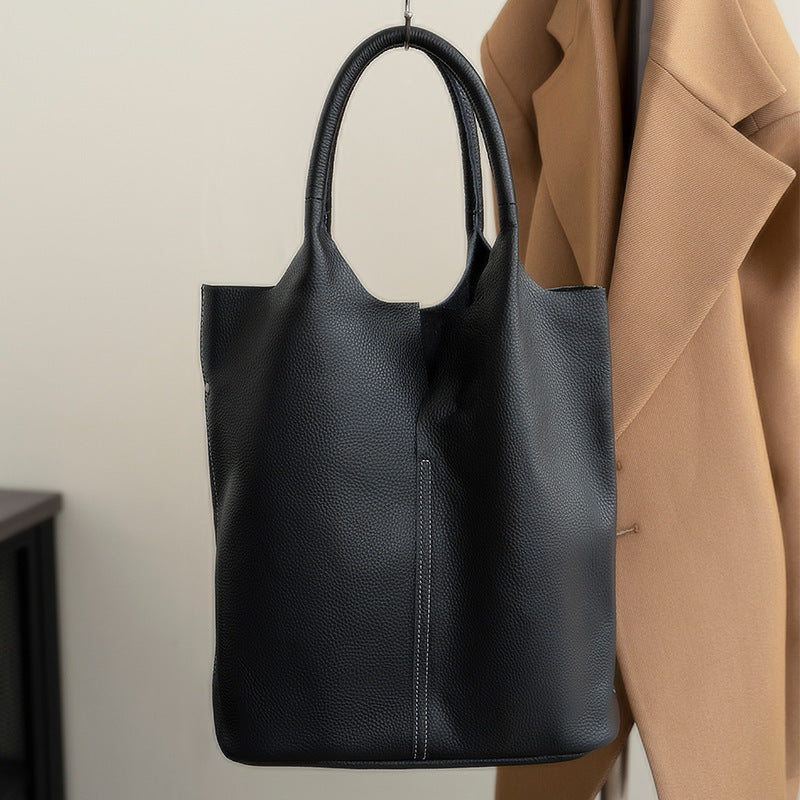 Side profile of black cowhide soft leather tote