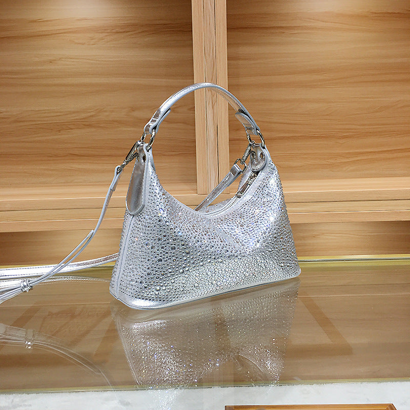 Interior view of black bag showing mobile phone pocket and zipper bag