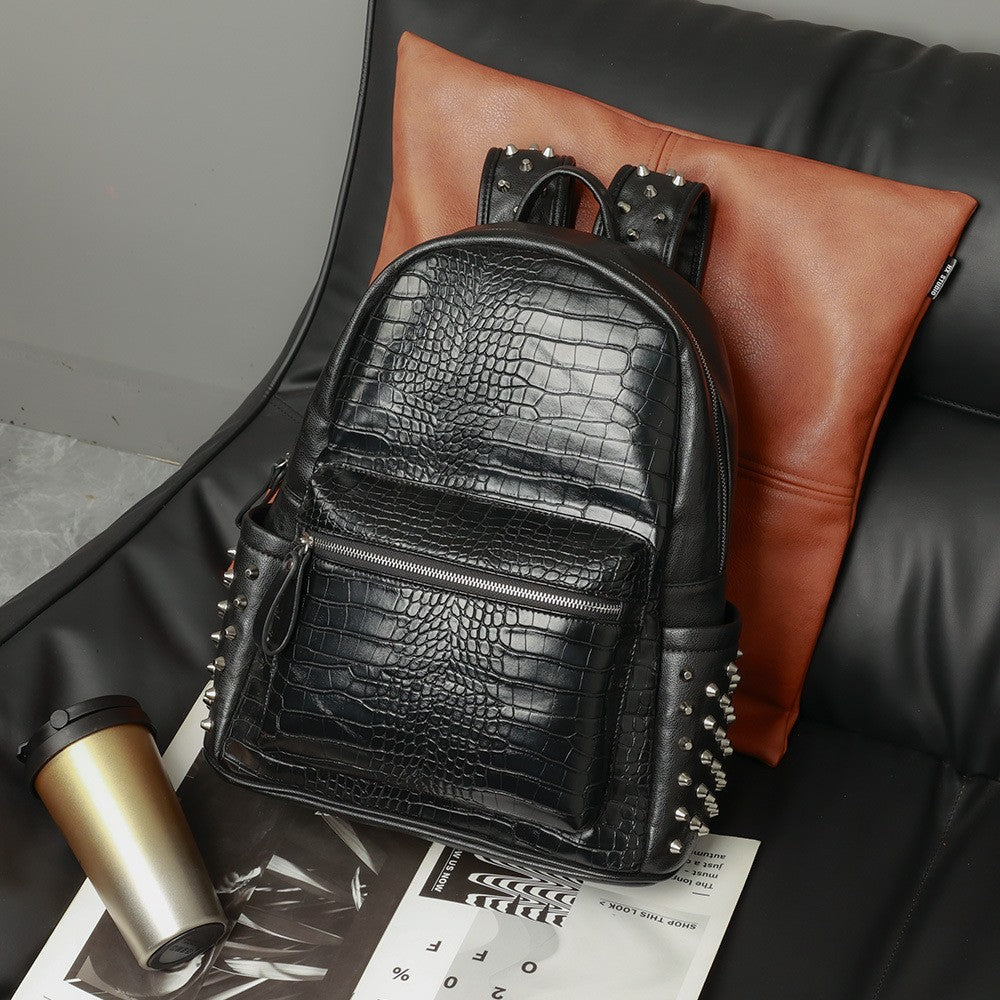 Front view of black PU leather laptop backpack with rivet accents