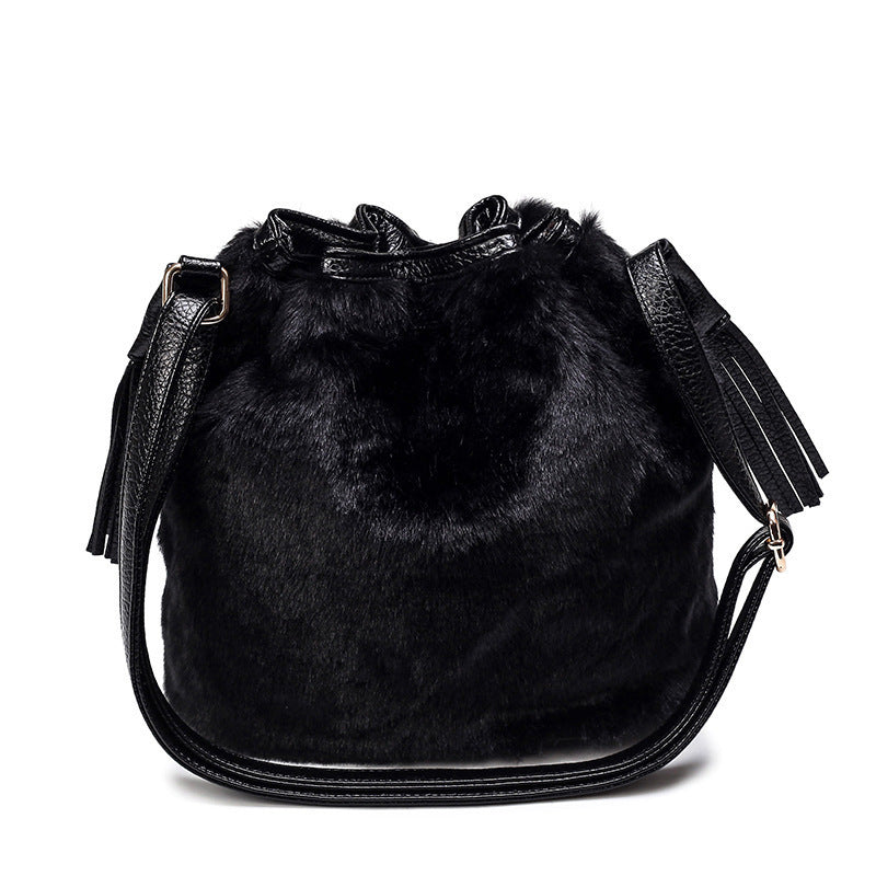 Interior view of the plush bucket bag showing ID bag, mobile pocket, and zipper pocket