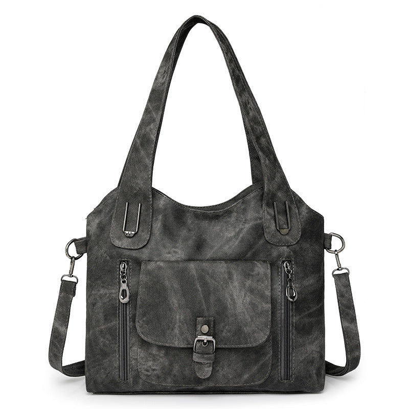 Model holding the bag crossbody style