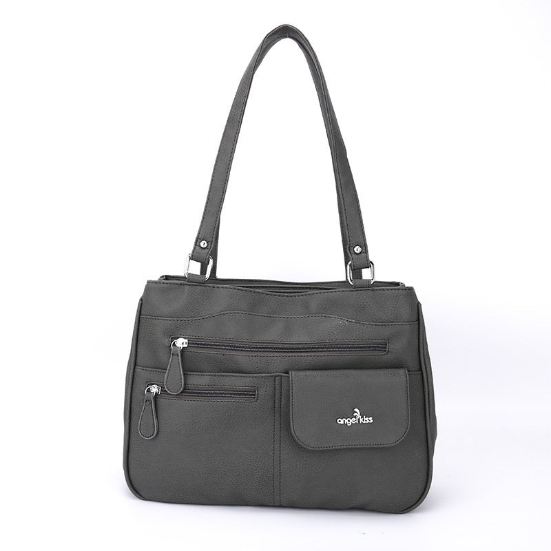 Close-up of decorative chain on PU leather tote bag