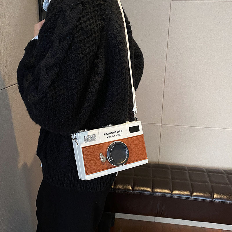 Close-up of zipper and soft PU leather on mini crossbody bag