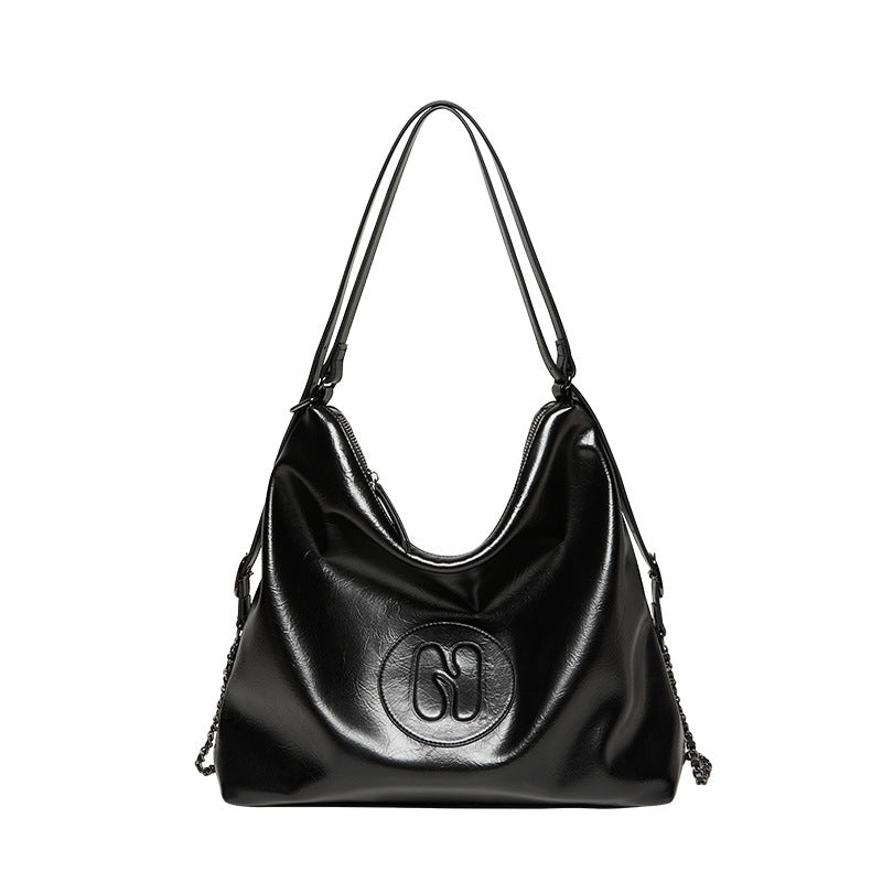 Side profile of synthetic leather commuter tote bag