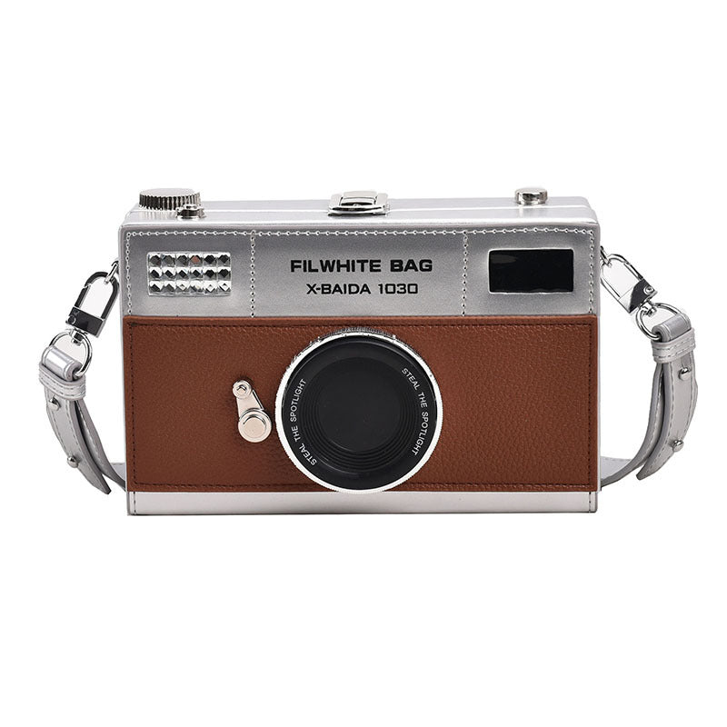 Mini camera bag displayed beside essential items