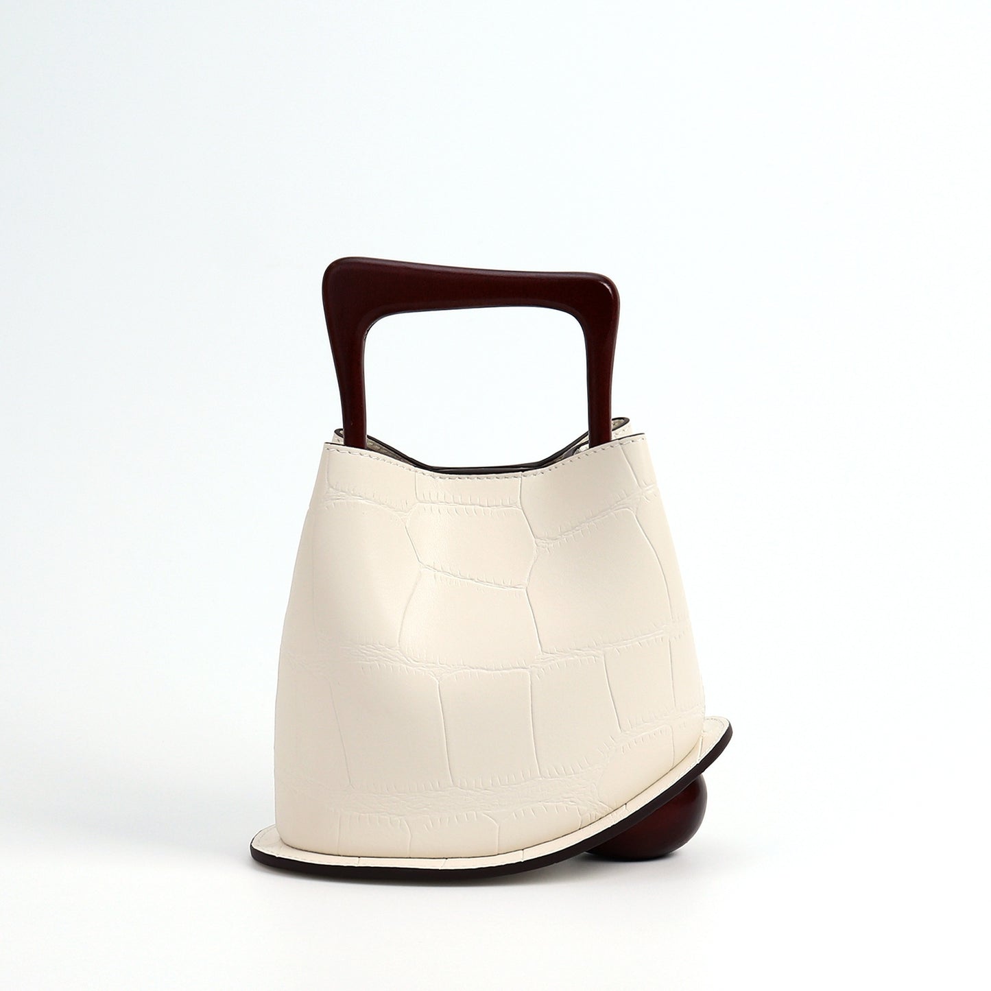 Model wearing the bucket bag with shoulder strap