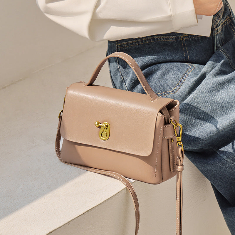 Front view of contrast color cowhide crossbody handbag