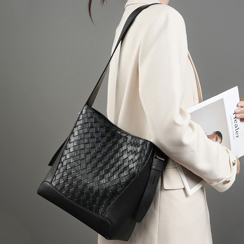Side view of women’s cowhide crossbody purse in black