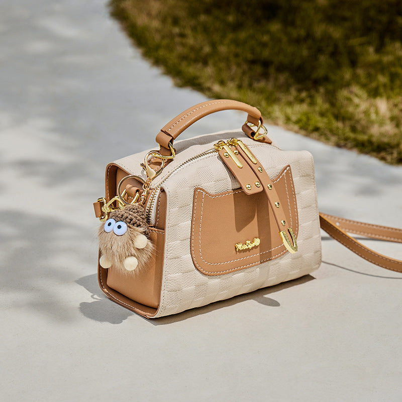Side profile of soft cowhide leather shoulder tote in pillow shape