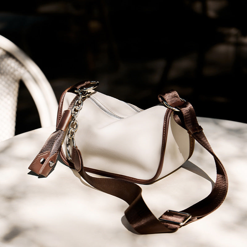 Top view of cream white saddle bag showing shoulder strap