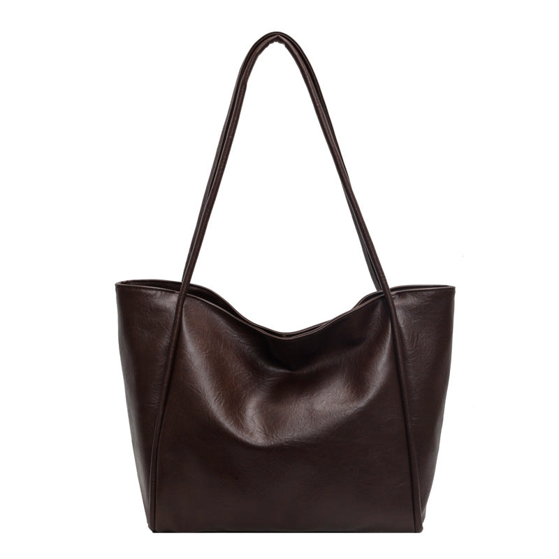 Close-up of PU leather texture and stitching on tote bag