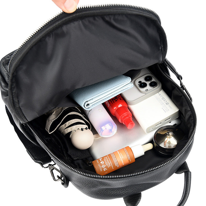 Large-capacity leather backpack with open compartments