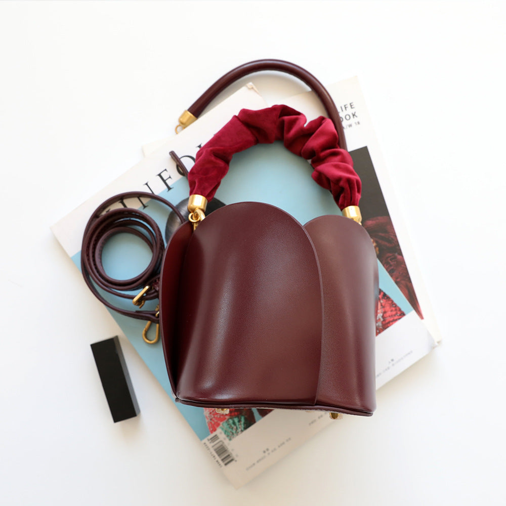 Close-up of the soft cowhide leather material of the Flower Bucket Bag.