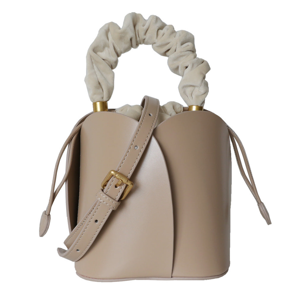 Flower bucket bag featuring a chic flower design and soft leather texture.