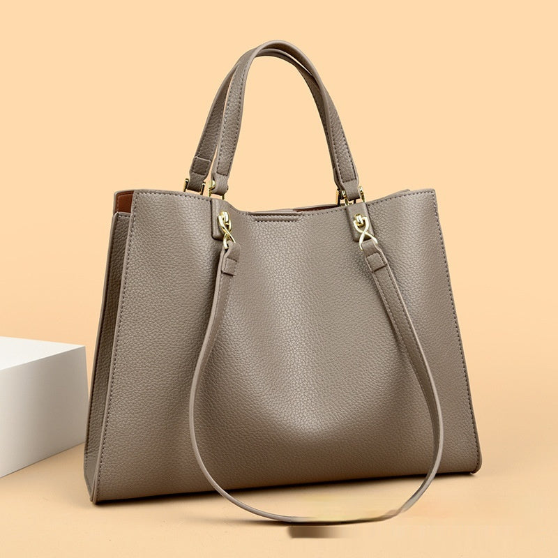 Top view of gray women’s PU leather messenger tote bag