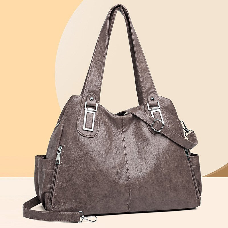 Close-up of handle and soft PU leather on women’s tote bag