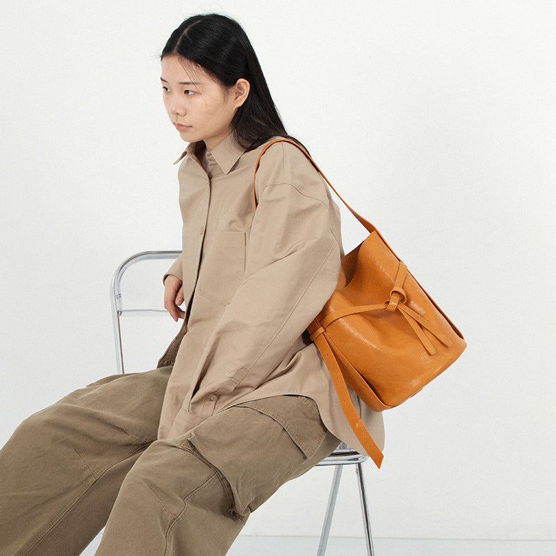 Interior of retro textured leather shoulder bucket bag