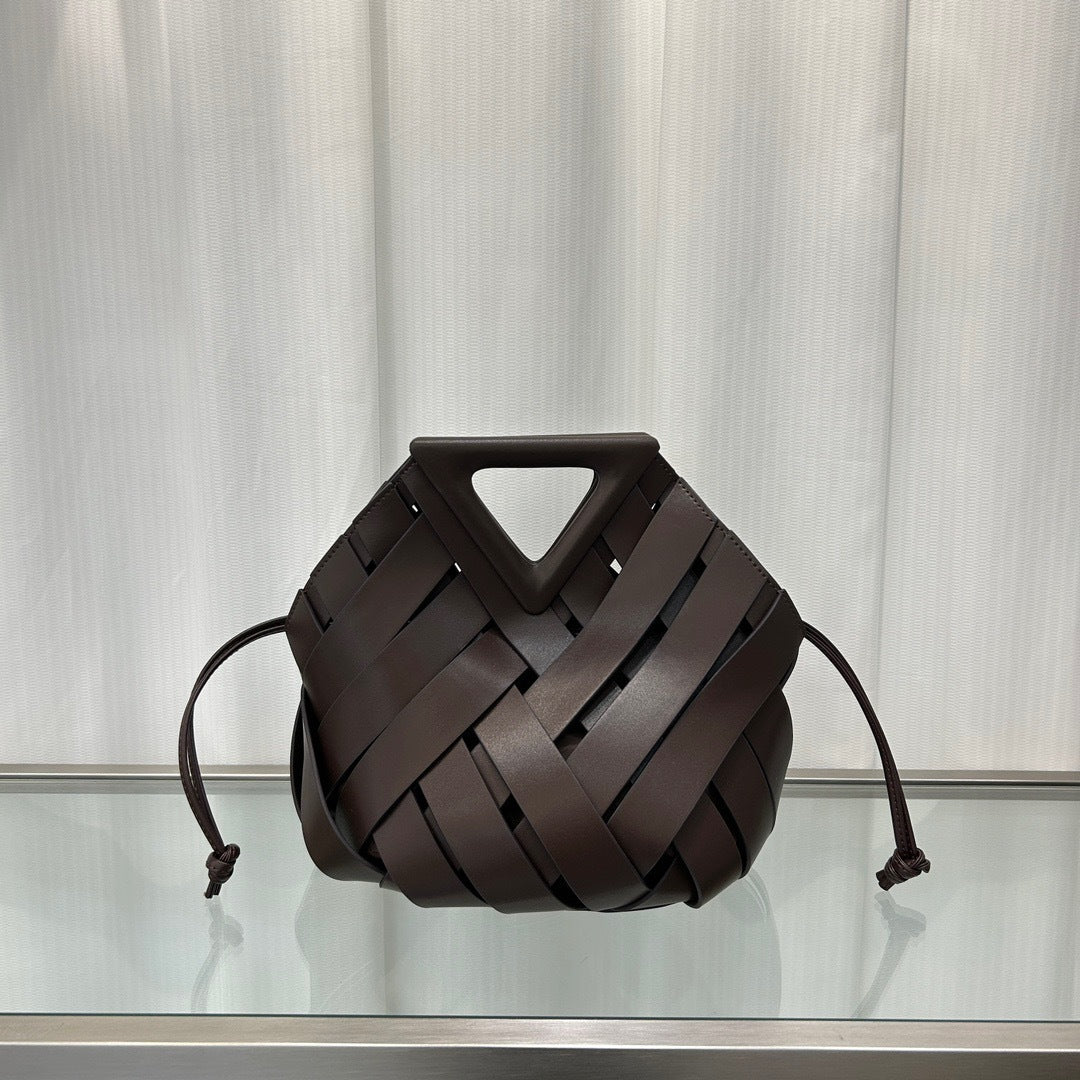 Interior of woven leather triangle bucket handbag