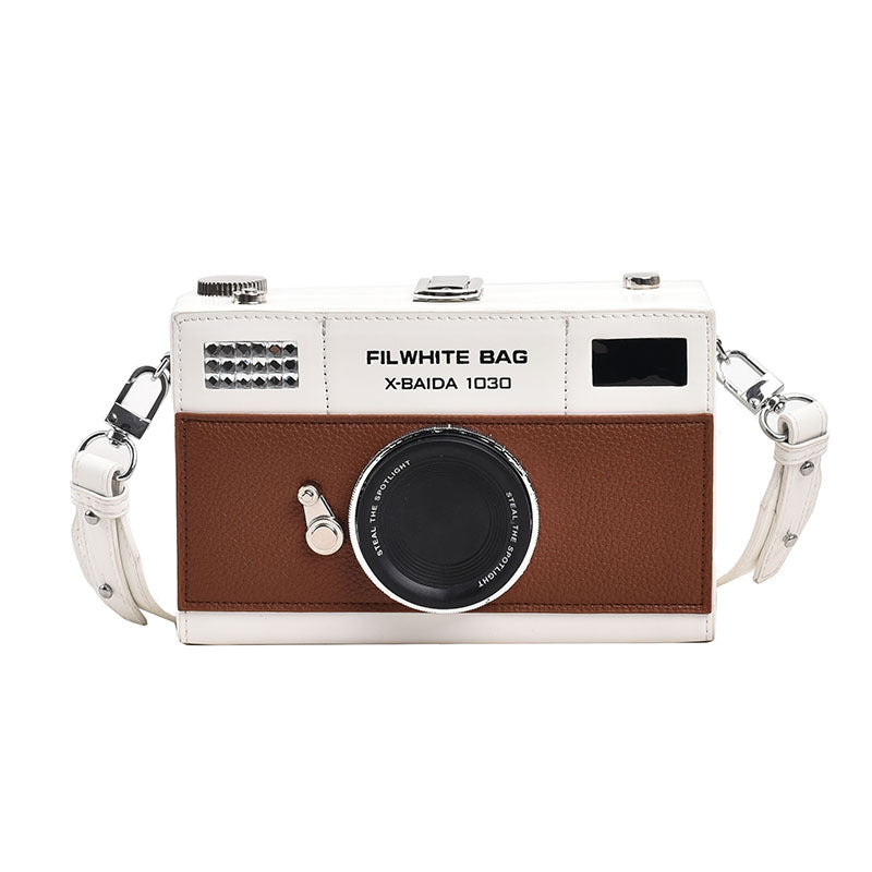 Woman wearing mini chain camera crossbody bag