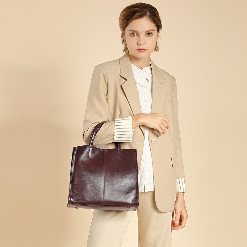 Black vertical square leather tote with double straps