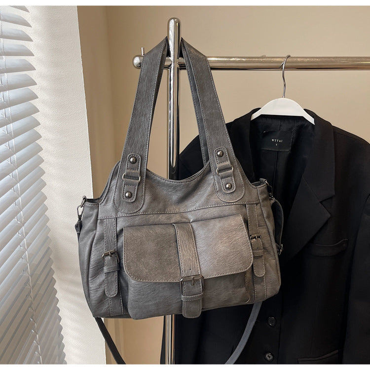 Modern dark gray shoulder bag with zip pocket