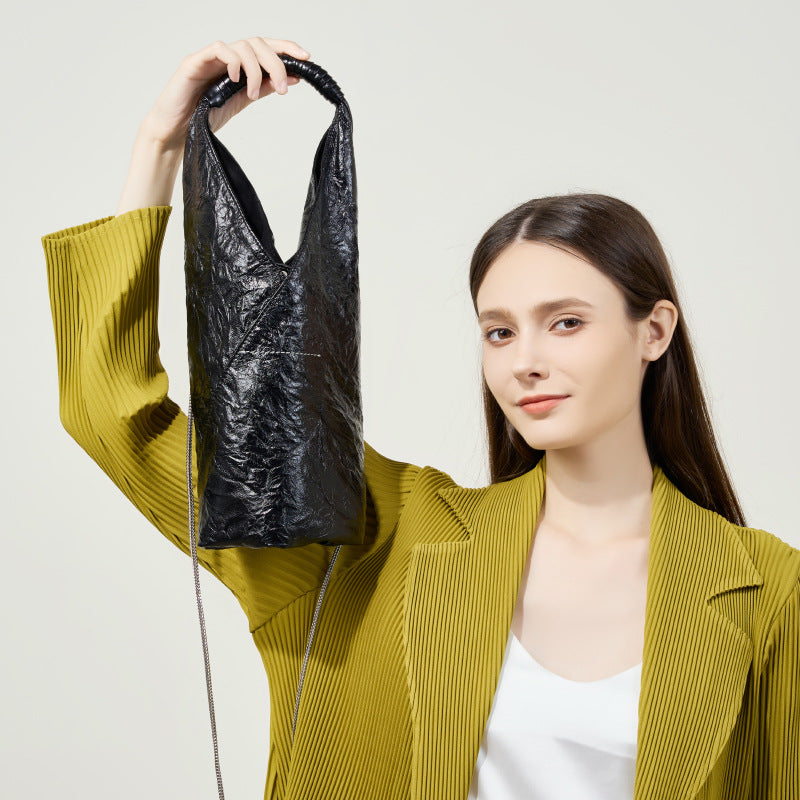 Folded leather design for structured softness
