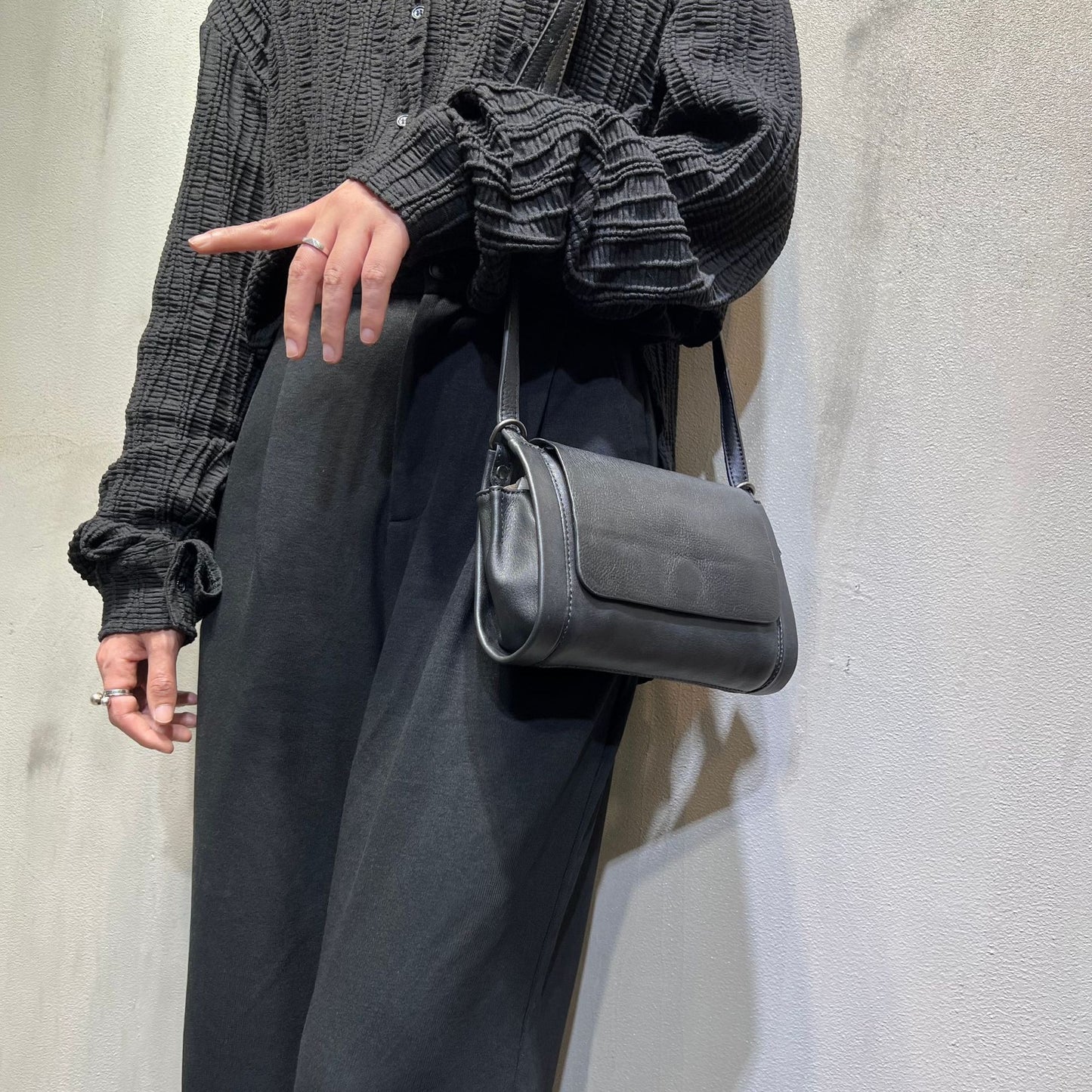 Structured horizontal square-shaped leather purse