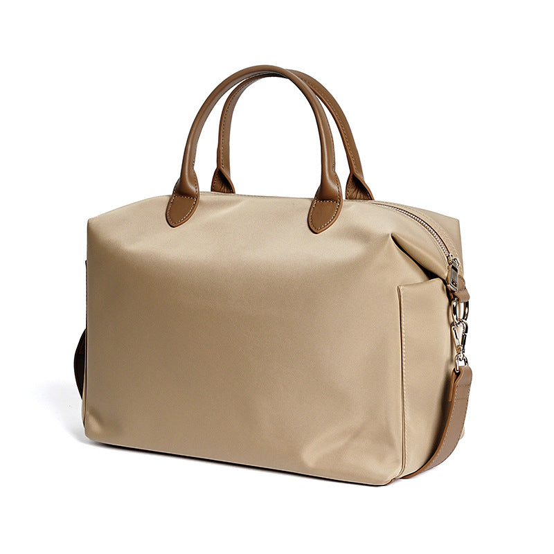 Woman carrying black waterproof nylon and leather tote