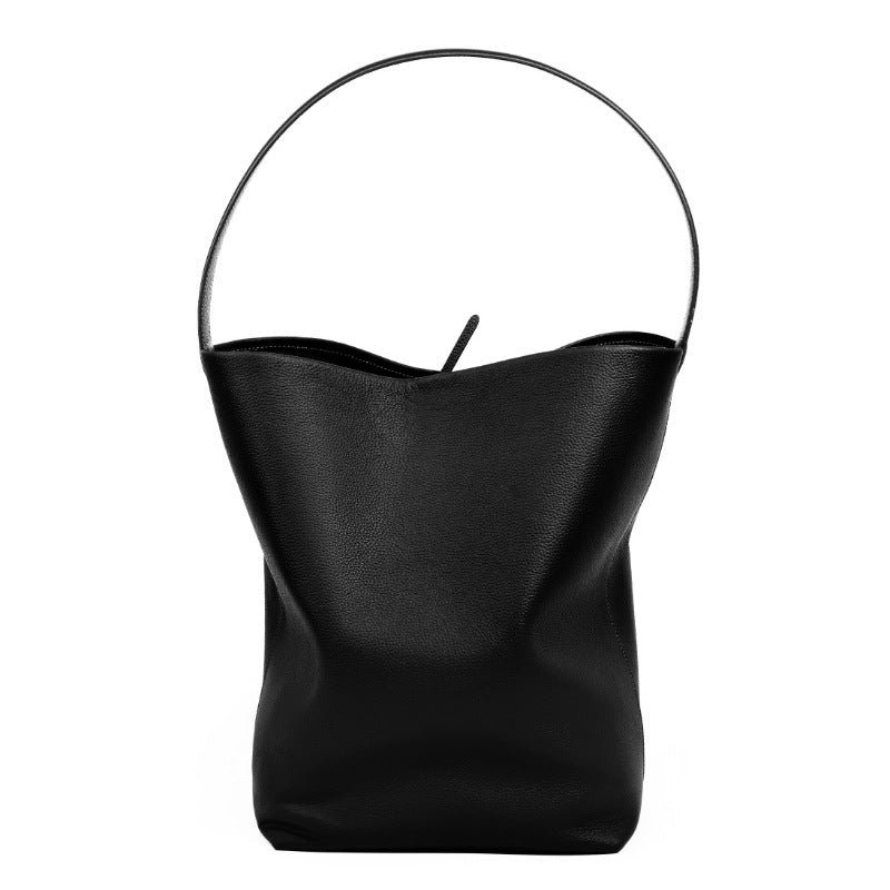 Side view of soft leather square vertical bucket bag