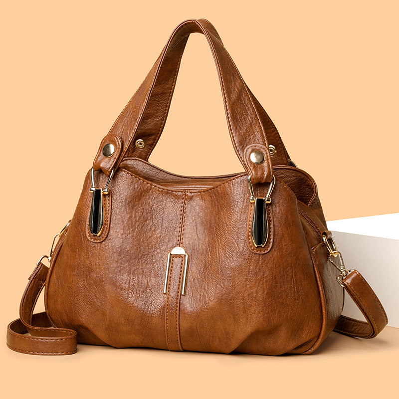 Side view of medium-soft spliced PU leather shoulder tote