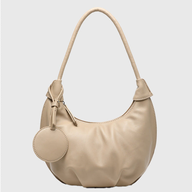 Side view of soft PU leather dumpling shoulder purse